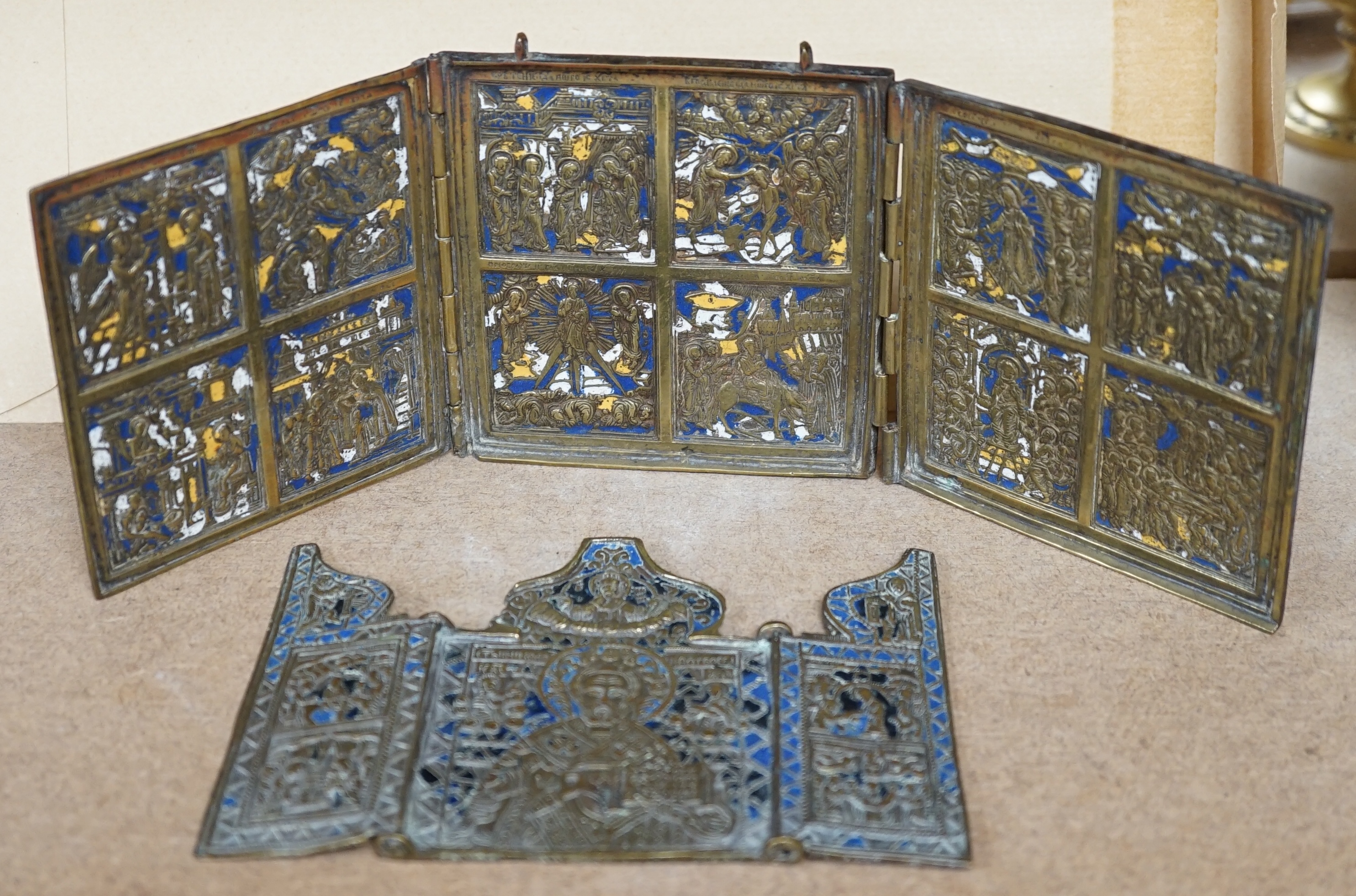 Two Russian Orthodox Church bronze and enamel triptych icons, largest 11cm high. Condition - fair